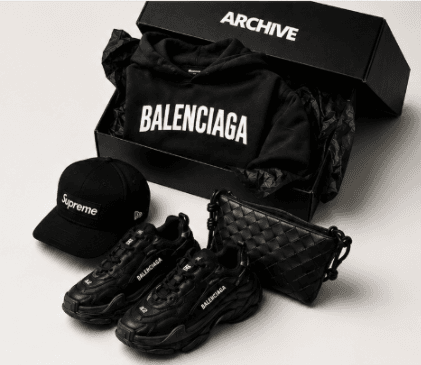Balenciaga hoodie in Archive box, Supreme cap, Balenciaga Triple S sneakers, Bottega Veneta woven bag